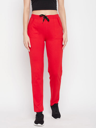 Red solid mid-rise cotton trackpants with elasticated waistband and drawstring.