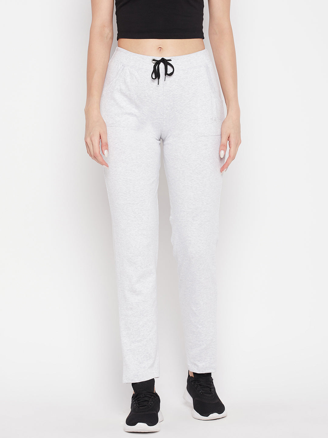 White solid mid-rise cotton trackpants with elastic waistband and drawstring.