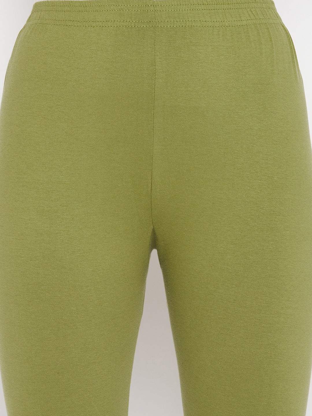 Olive solid ankle length leggings with elasticated waistband.