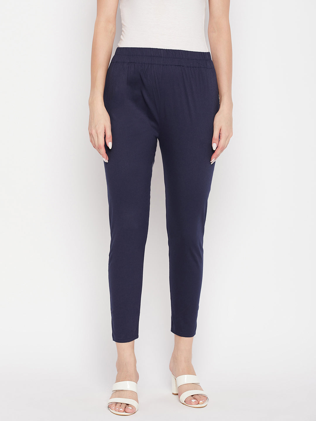 Navy blue solid cotton lycra pant with elasticated waistband and ankle length.