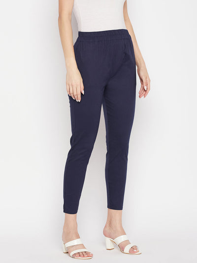 Navy blue solid cotton lycra pant with elasticated waistband.