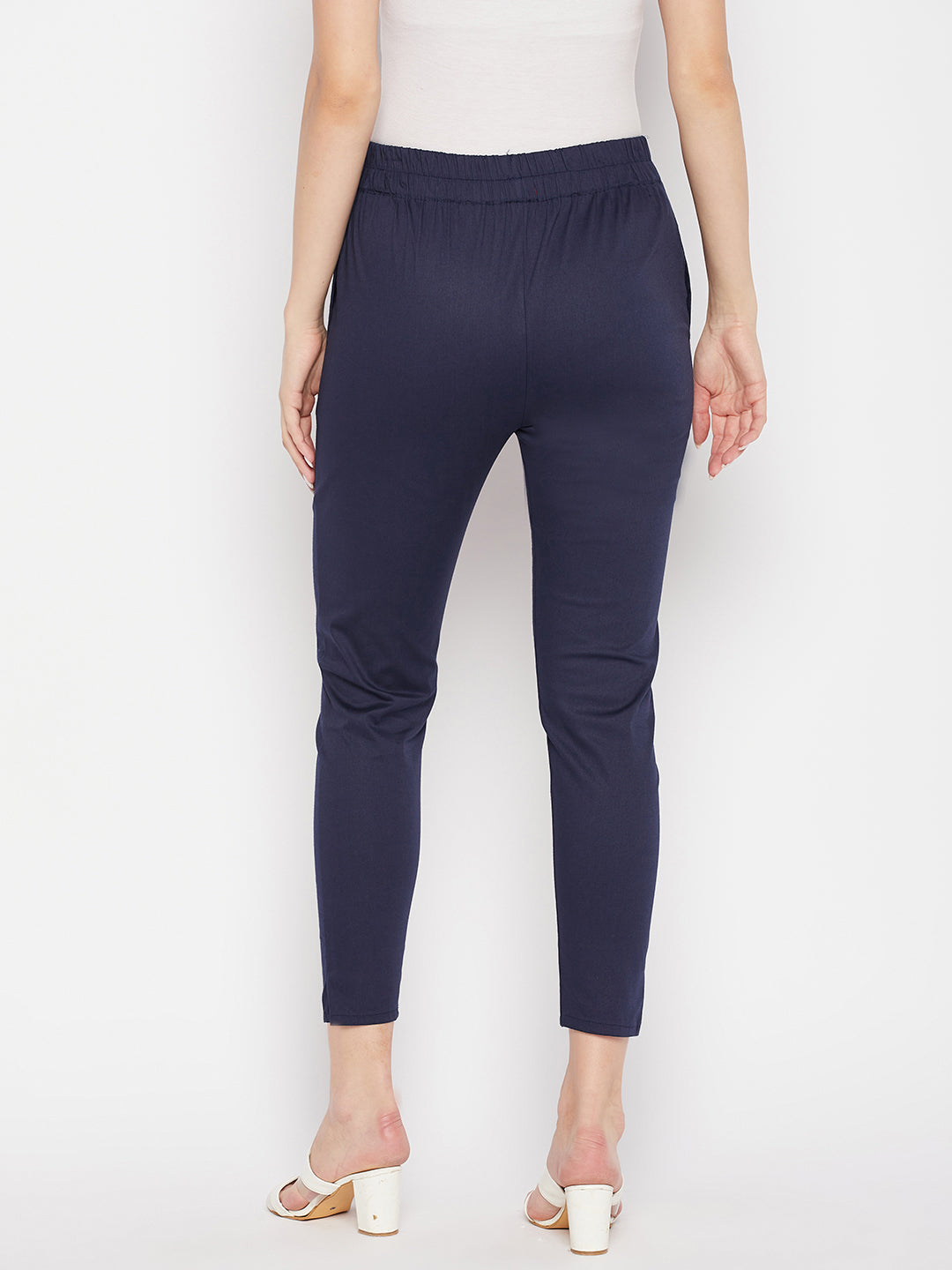 Navy blue solid cotton lycra pant, ankle length, elasticated waistband.