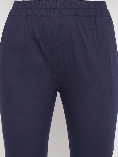 Navy blue solid cotton lycra pant with elasticated waistband and ankle length design.