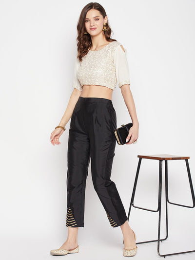 Black solid taffeta silk trouser with ankle length and partially elasticated waistband.