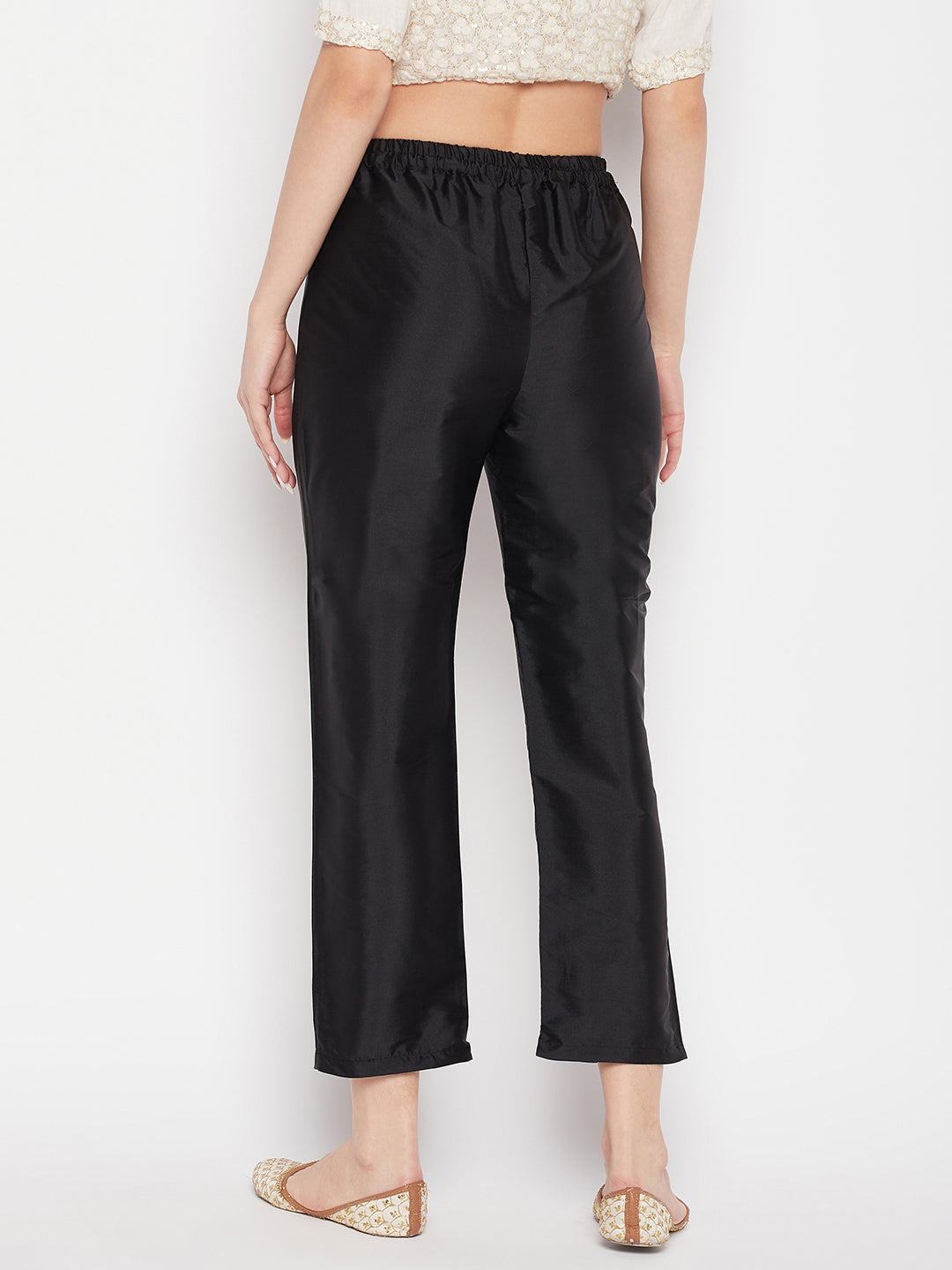 Black solid taffeta silk trouser with partially elasticated waistband, ankle length.
