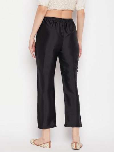Black solid taffeta silk trouser with partially elasticated waistband, ankle length.