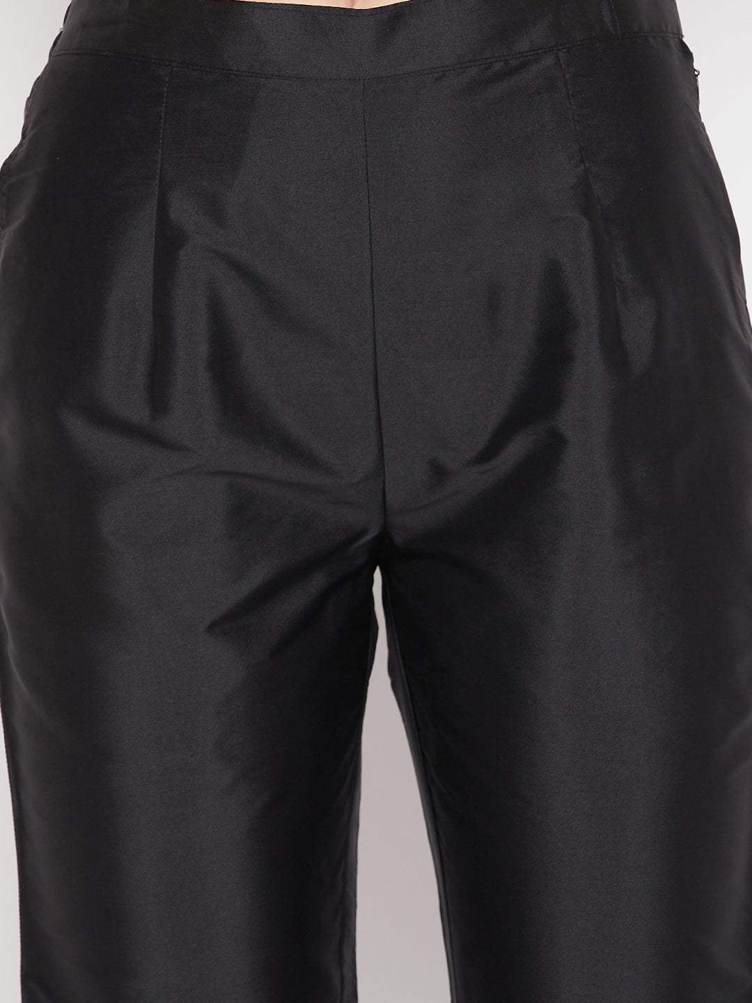 Black solid taffeta silk trousers with partially elasticated waistband.