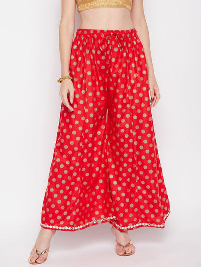 Red polka dot rayon sharara with embellished hem and elasticated waistband.