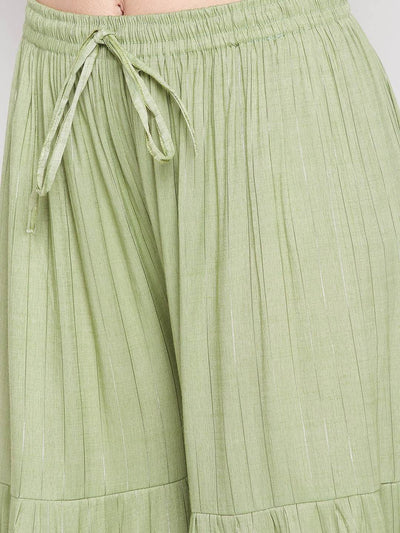 Pista Green Embellished Rayon Gharara with flared hem and elasticated waistband.