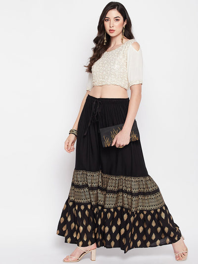 Black printed rayon flared gharara with an elasticated waistband and drawstring.