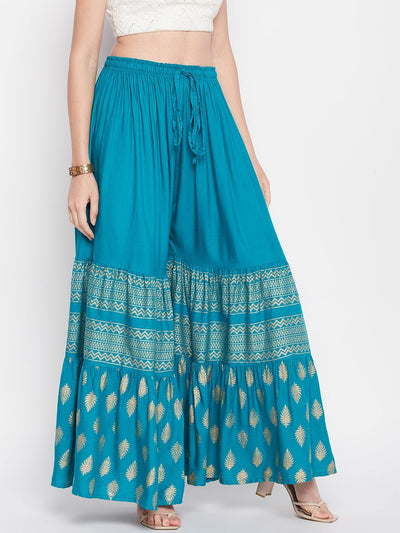 Rama green printed rayon flared gharara with elasticated waistband and drawstring.