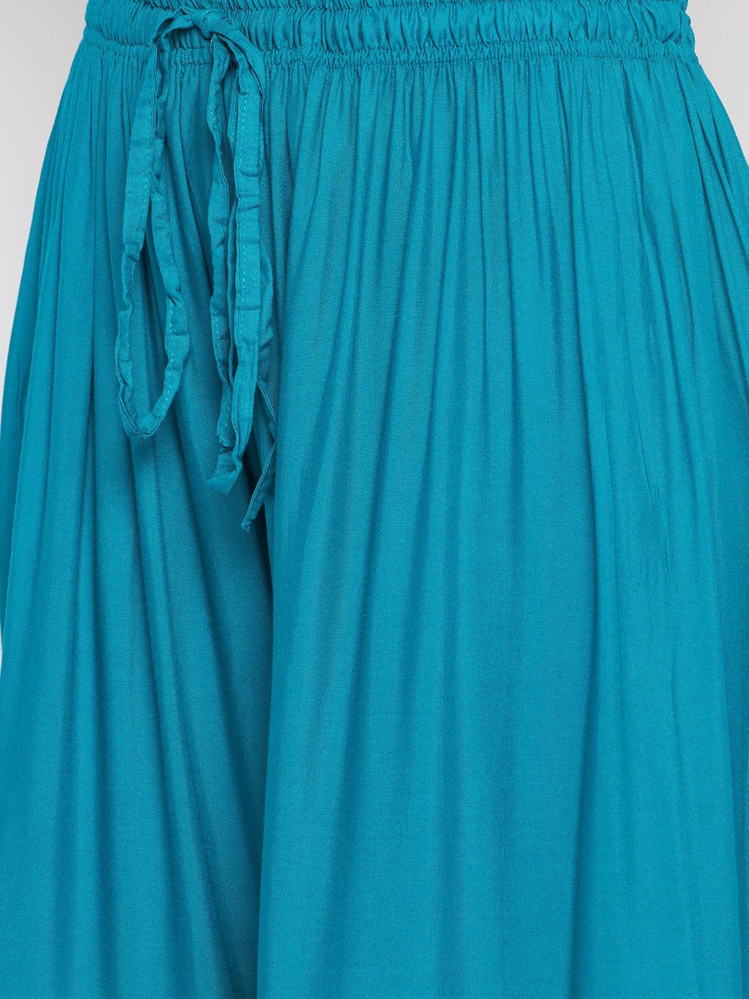 Rama Green Printed Rayon Flared Gharara with elastic waistband and drawstring.