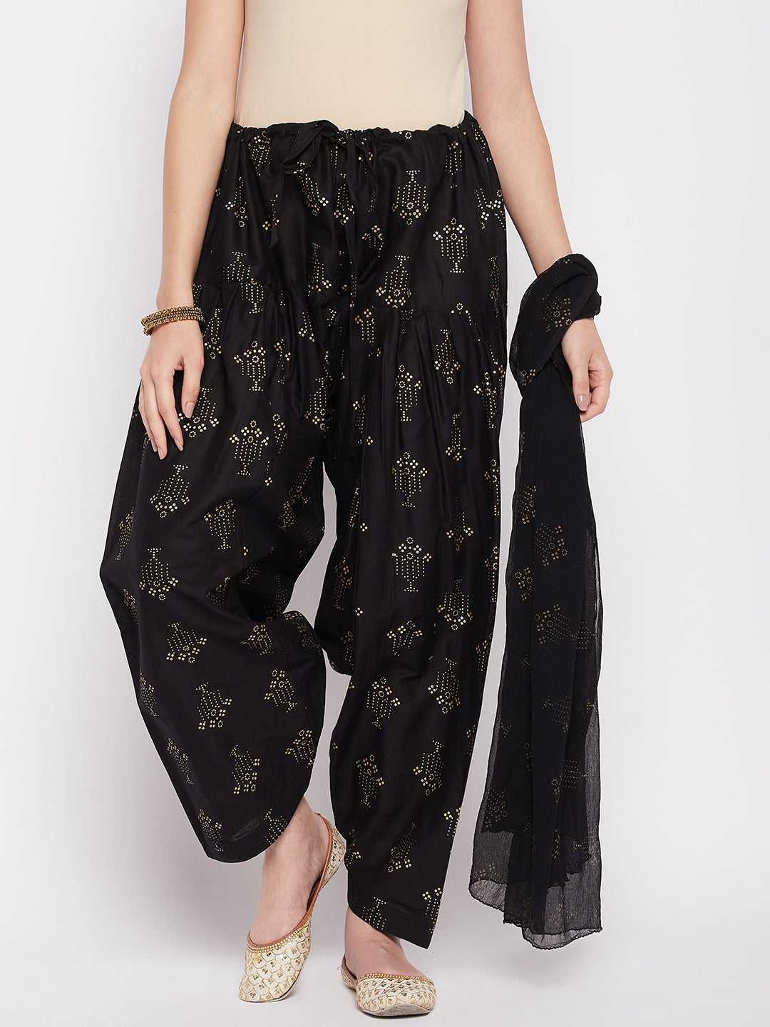 Black printed cotton salwar with matching chiffon dupatta and drawstring waistband.