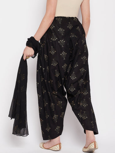 Black printed cotton salwar and chiffon dupatta with drawstring waistband.