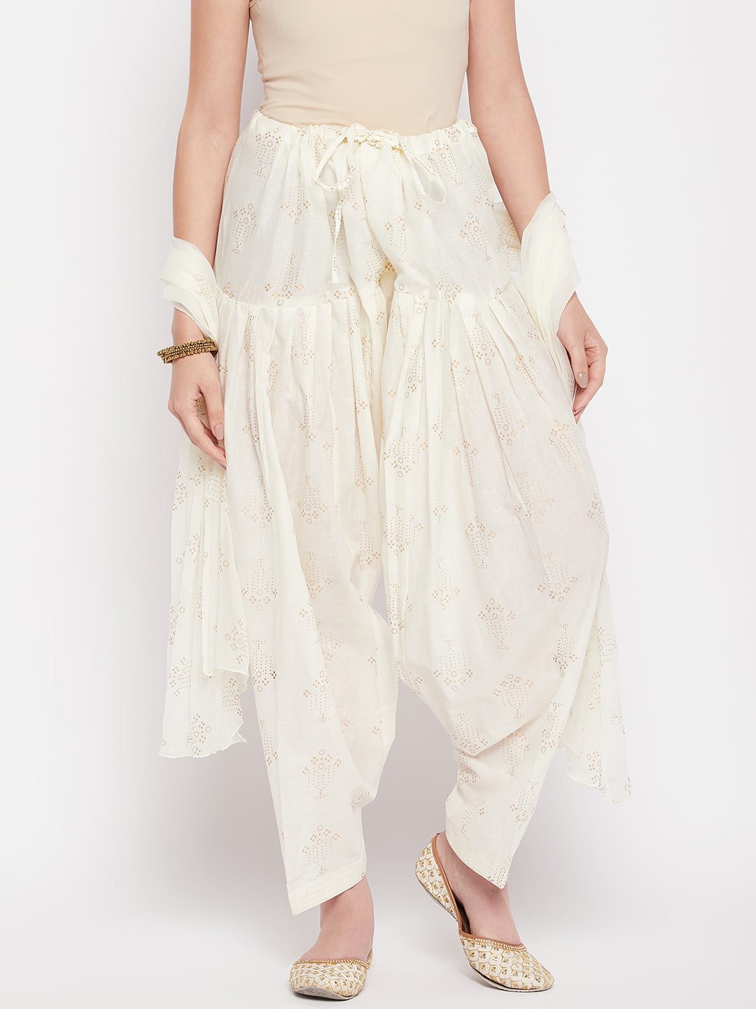 Off-White printed cotton salwar with chiffon dupatta and drawstring waistband.