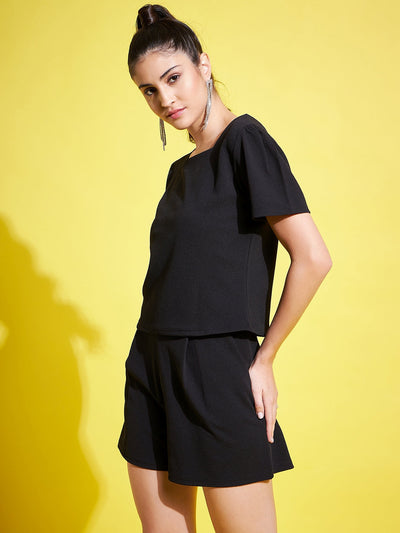 Black solid regular fit top with V-neck and half sleeves.