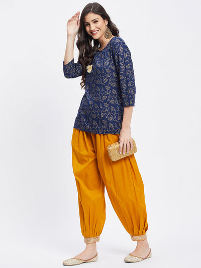 Mustard embellished Afghani salwar with elastic waistband and hemline detail.
