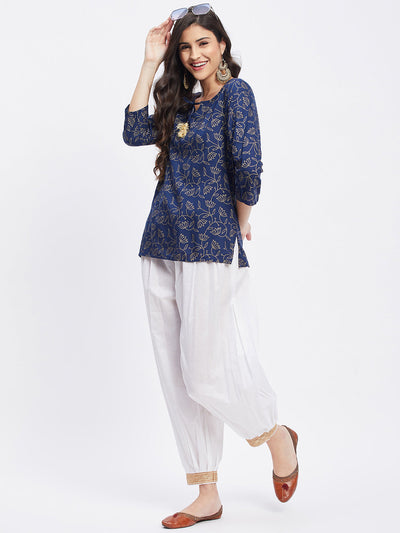 White embellished Afghani salwar with elasticated waistband and embellished hemline.