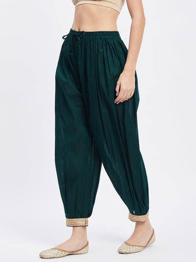 Bottle Green Embellished Afghani Salwar with elastic waistband and drawstring.