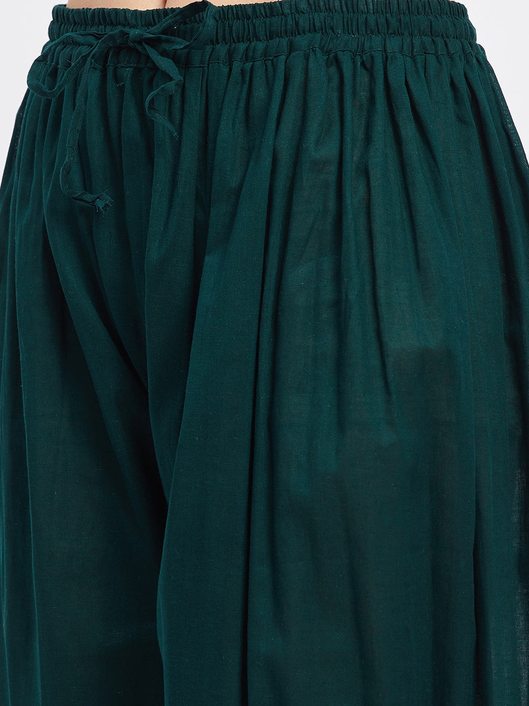 Bottle green embellished Afghani salwar with elasticated waistband and drawstring.