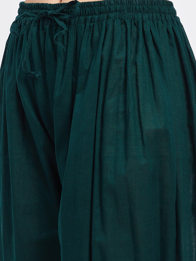 Bottle green embellished Afghani salwar with elasticated waistband and drawstring.