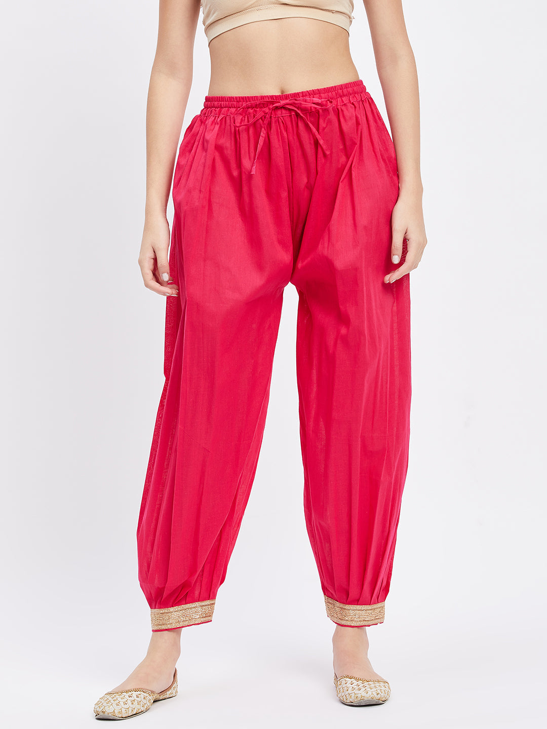 Magenta Embellished Afghani Salwar with elasticated waistband and embellished hemline.