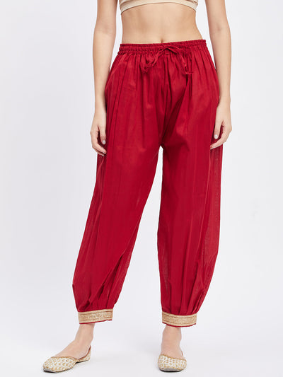 Maroon embellished Afghani salwar with elasticated waistband and drawstring.
