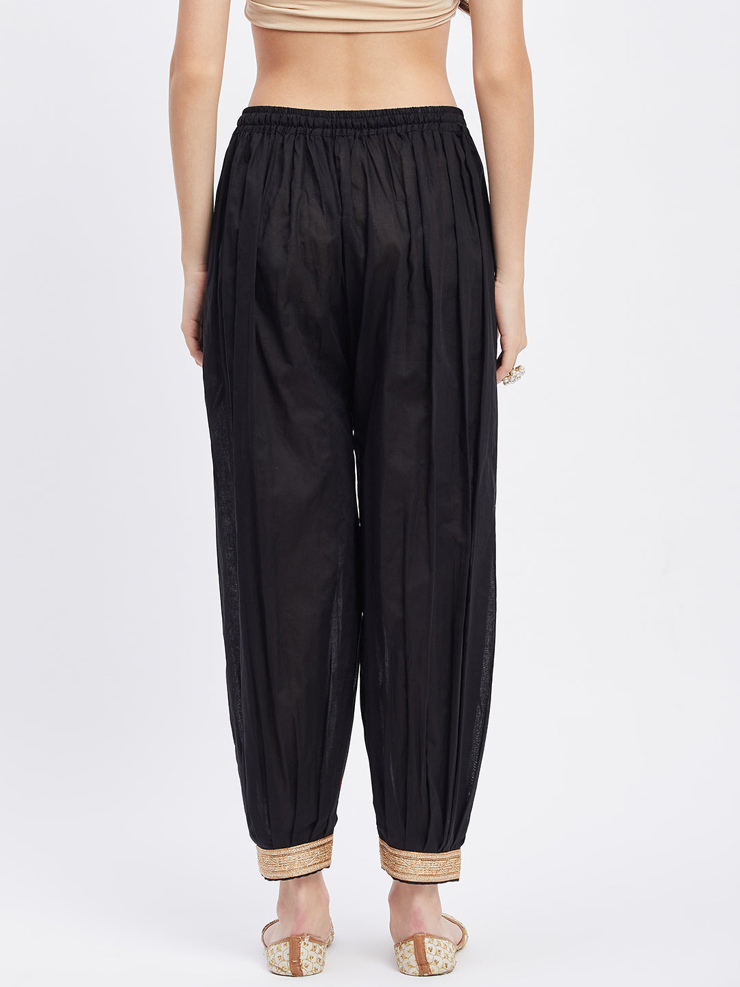 Black embellished Afghani salwar with elasticated waistband and drawstring, featuring embellished hemline.