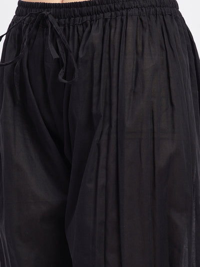 Black embellished Afghani salwar with elasticated waistband and drawstring, featuring embellished hemline.