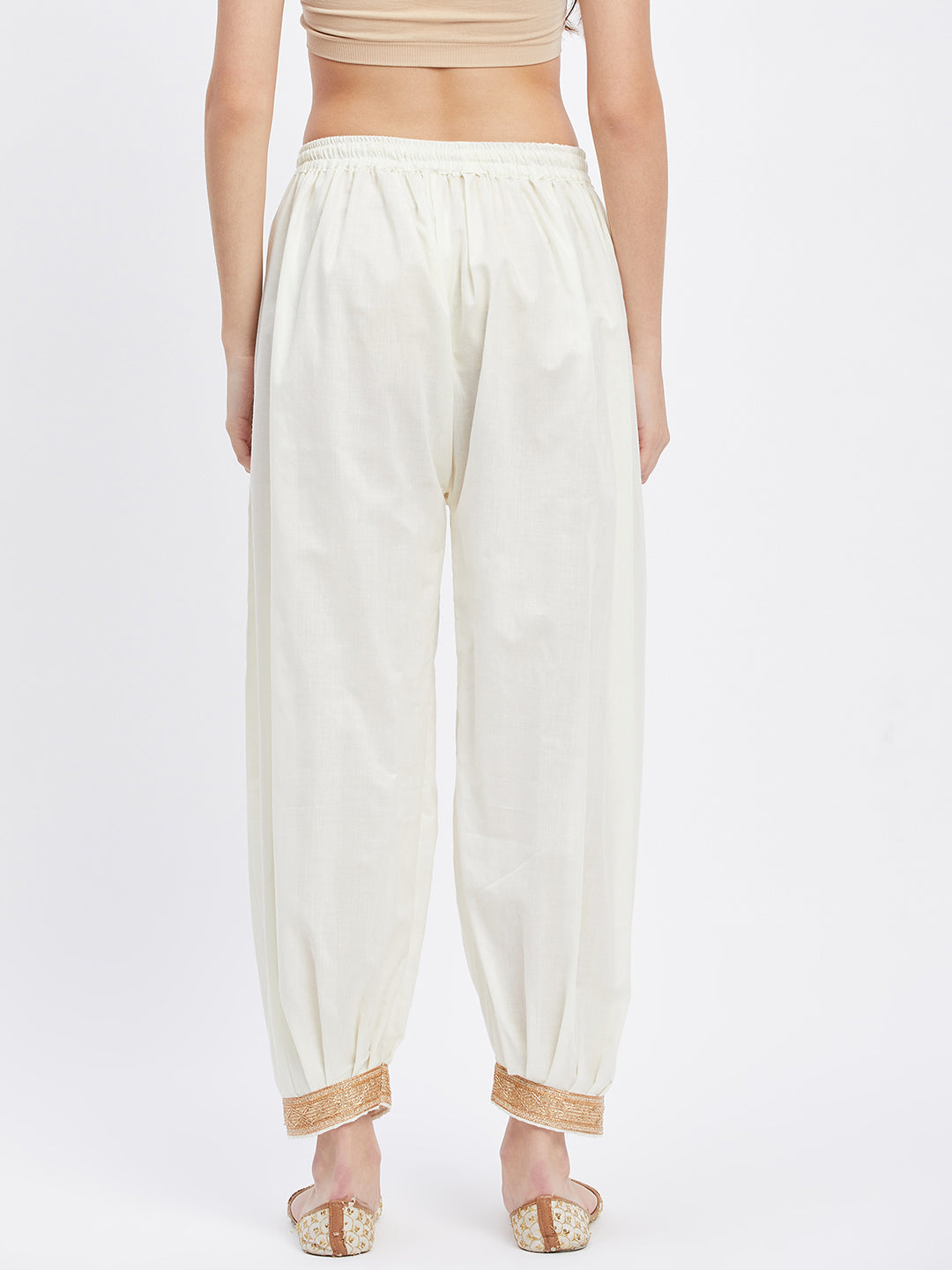 Cream Embellished Afghani Salwar with elasticated waistband and decorative hemline.