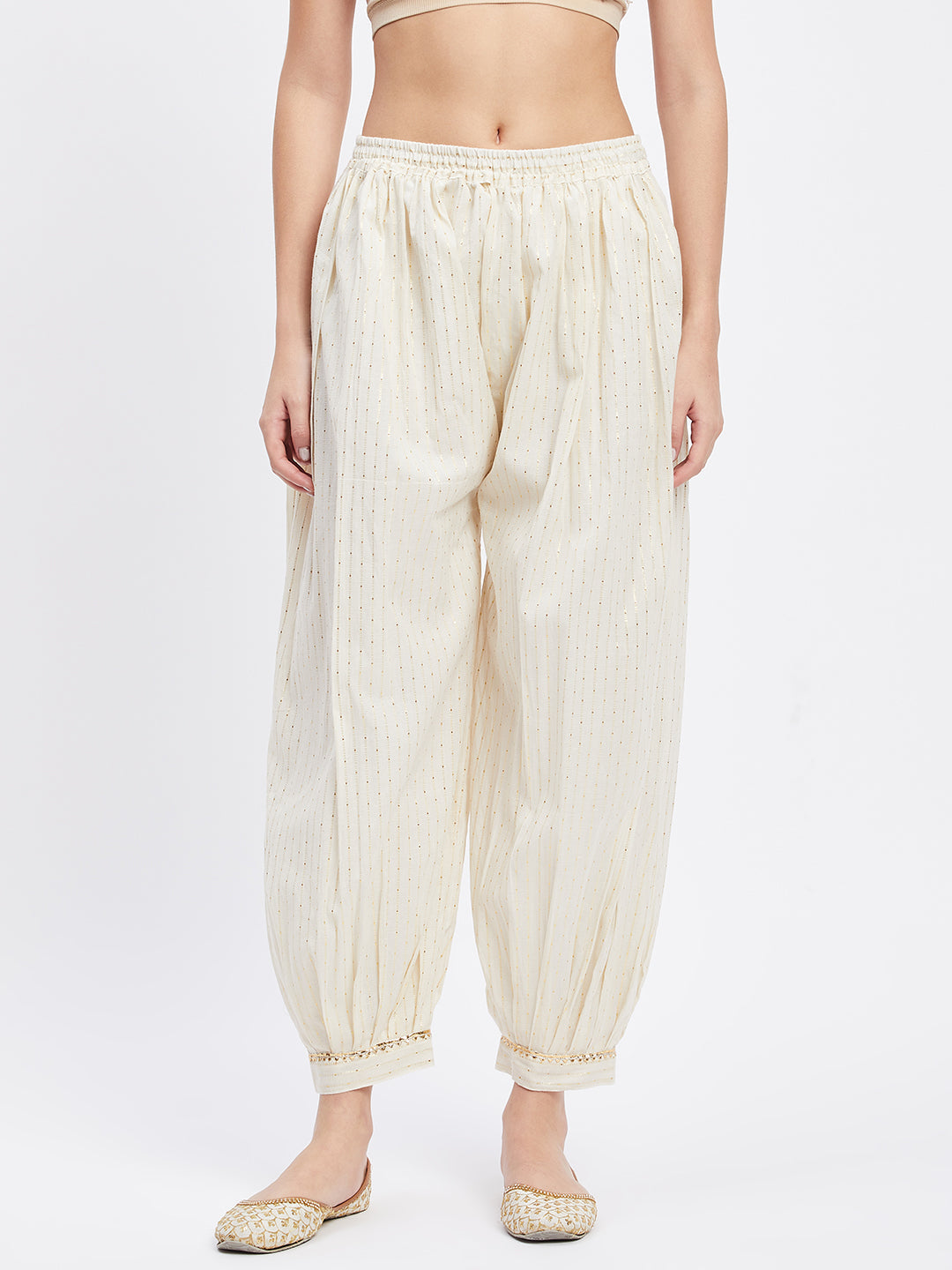 Off-white embellished golden Afghani salwar with elastic waistband and drawstring.