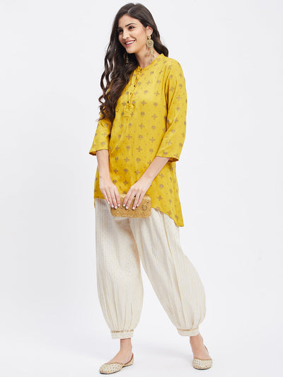 Off-white embellished golden self-design Afghani salwar with elasticated waistband and drawstring.