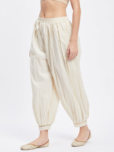 Off-white embellished golden Afghani salwar with elastic waistband and drawstring.
