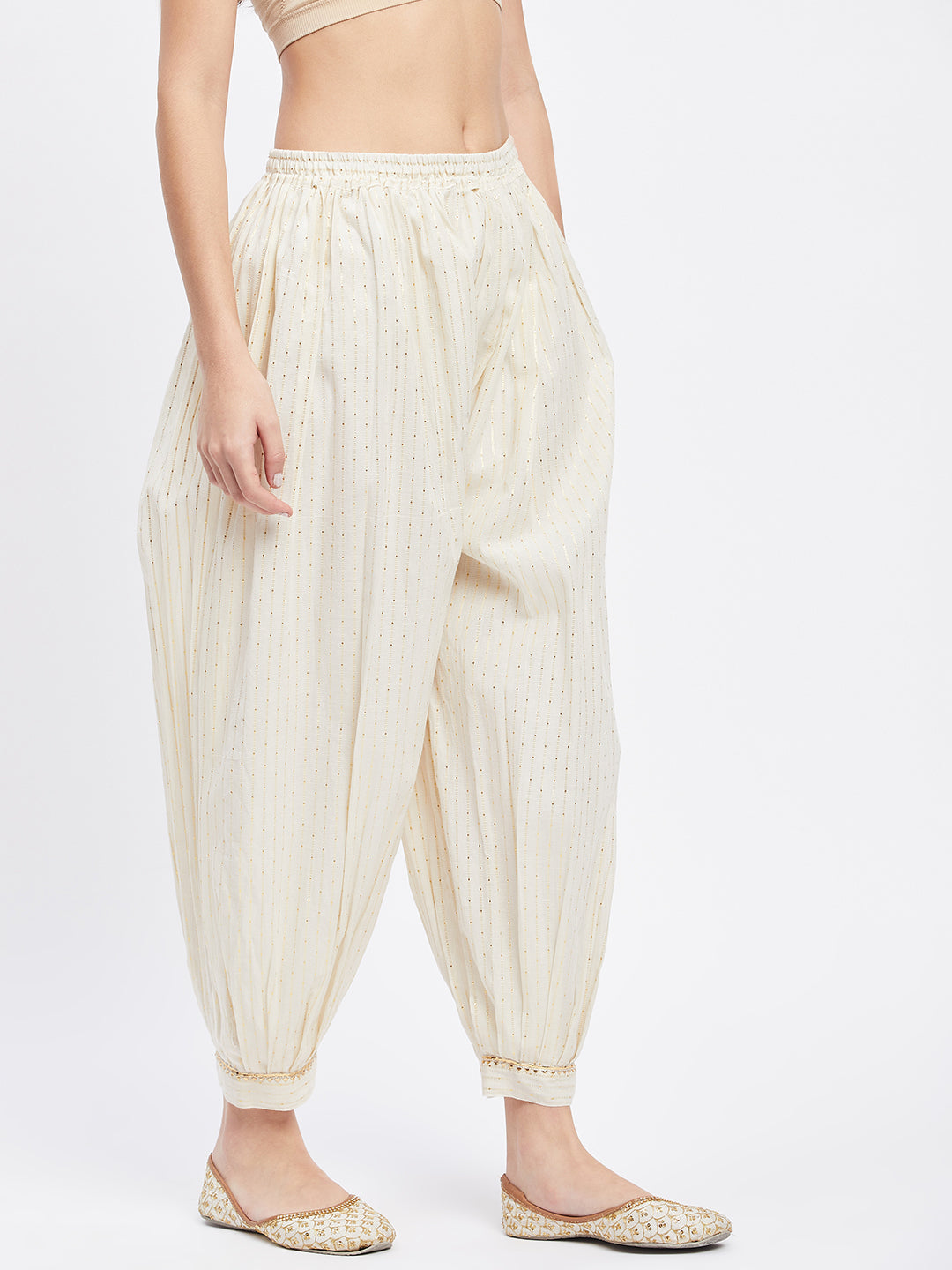 Off-White Embellished Golden Self Design Cotton Afghani Salwar with elastic waistband and embellished hemline.