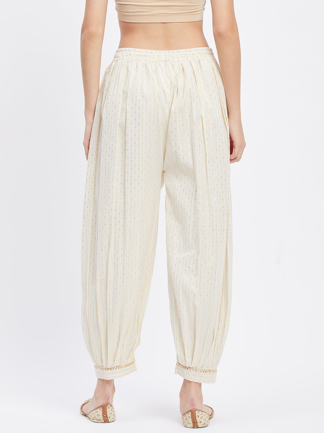 Off-White Embellished Golden Afghani Salwar with self design and elasticated waistband.