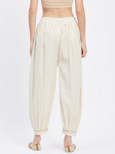 Off-White Embellished Golden Afghani Salwar with self design and elasticated waistband.