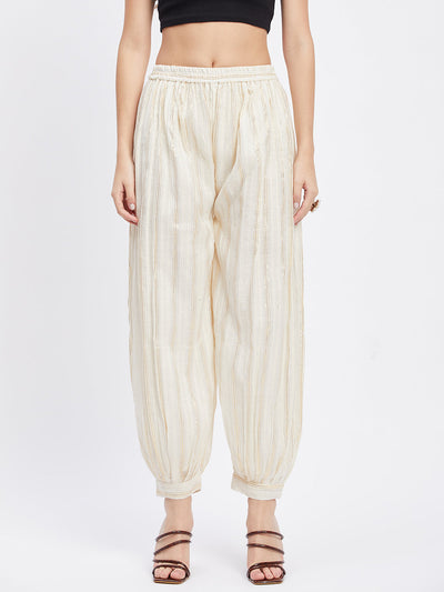 Off-White embellished golden Afghani salwar with elasticated waistband.
