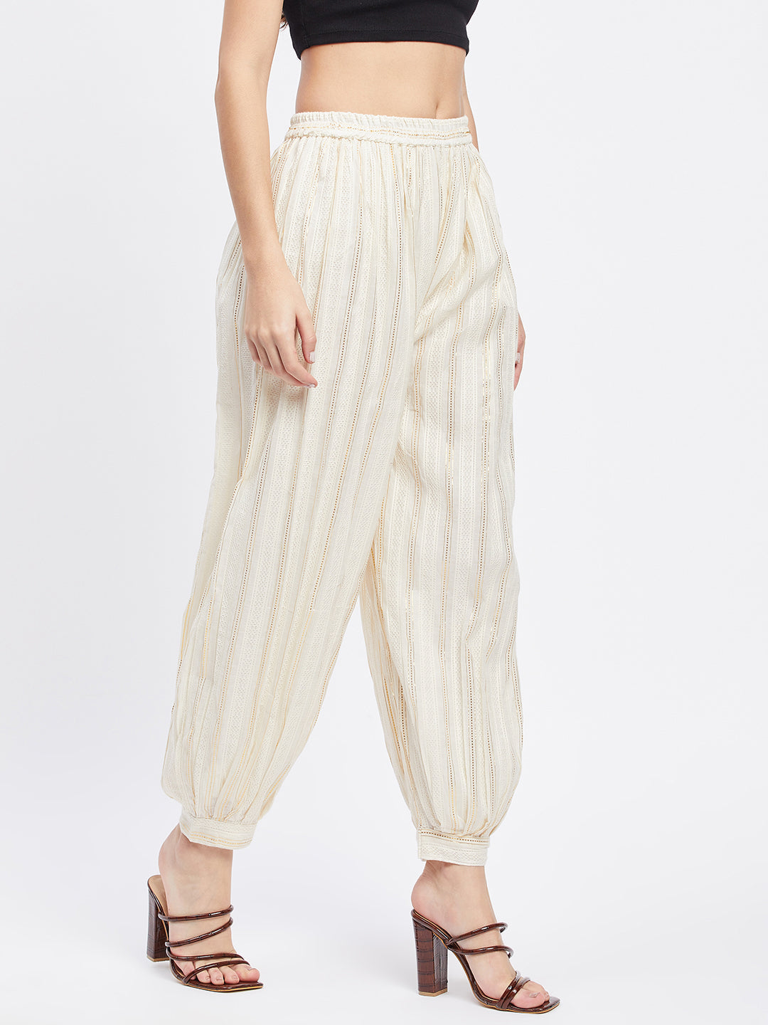 Off-White Embellished Golden Afghani Salwar with elastic waistband and drawstring.