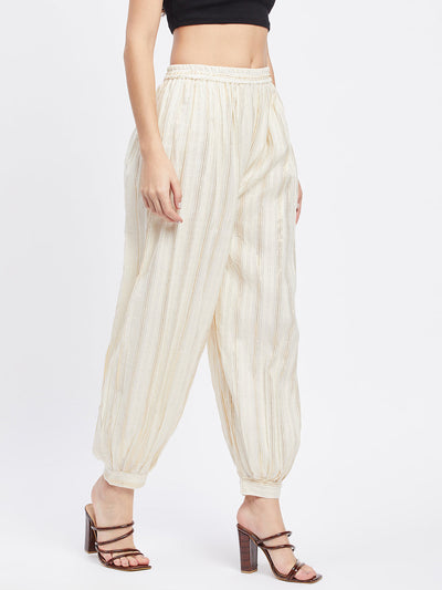 Off-White Embellished Golden Afghani Salwar with elastic waistband and drawstring.