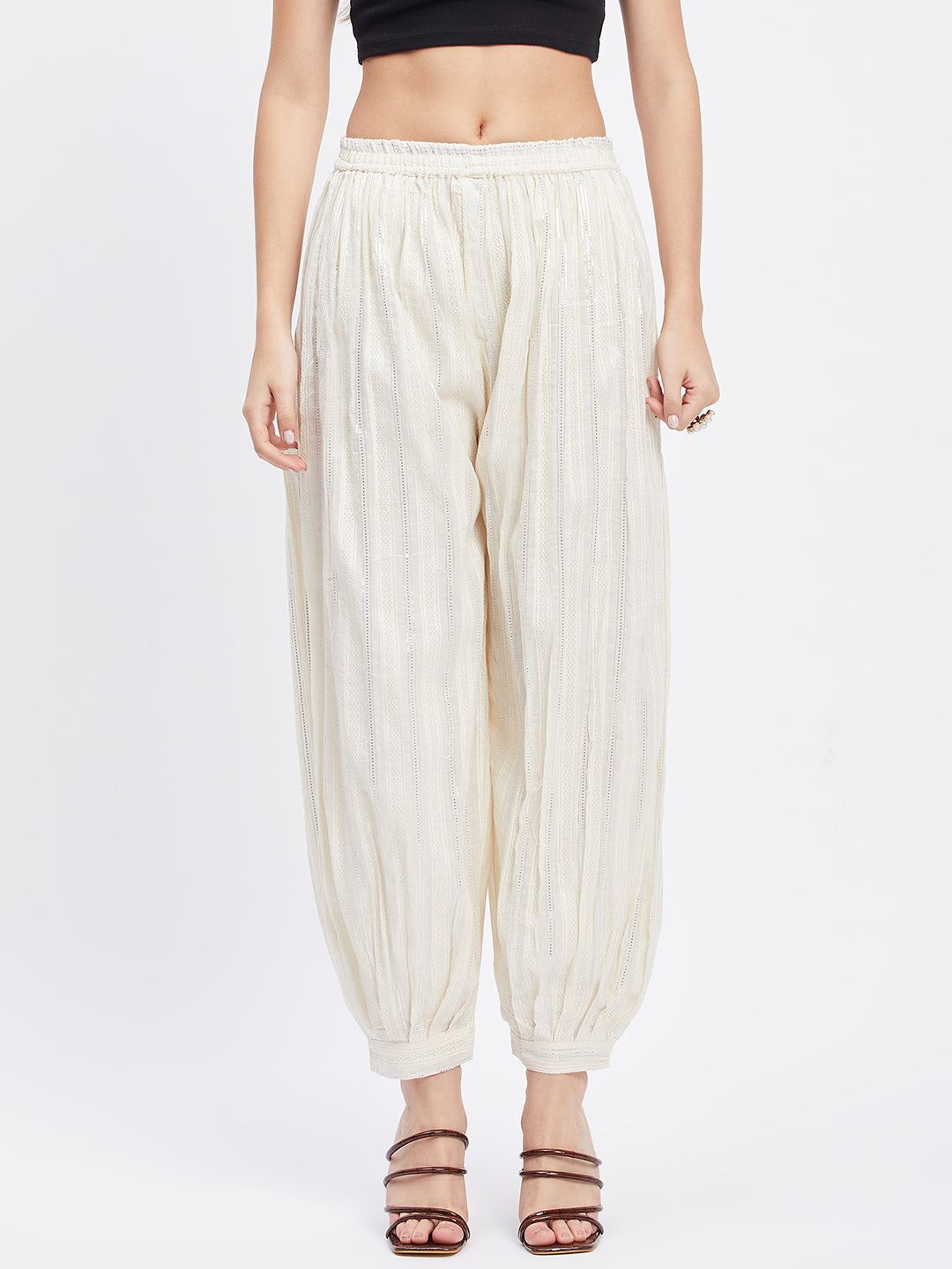 Off-White Embellished Silver Afghani Salwar with elasticated waistband and drawstring.