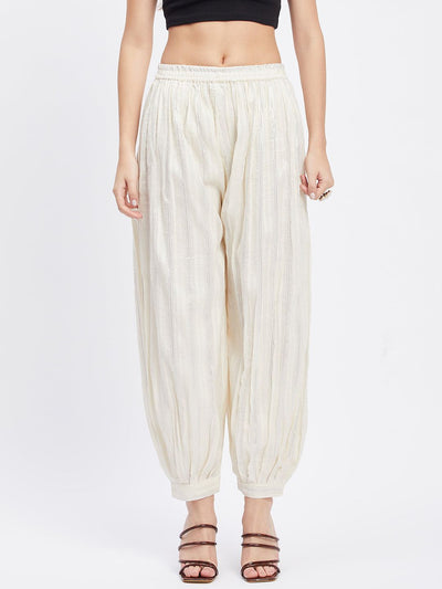 Off-White Embellished Silver Afghani Salwar with elasticated waistband and drawstring.