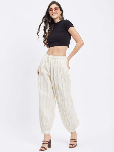 Off-White embellished silver Afghani salwar with elasticated waistband and drawstring.