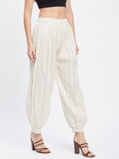 Off-White embellished Afghani salwar with elastic waistband and silver self-design.
