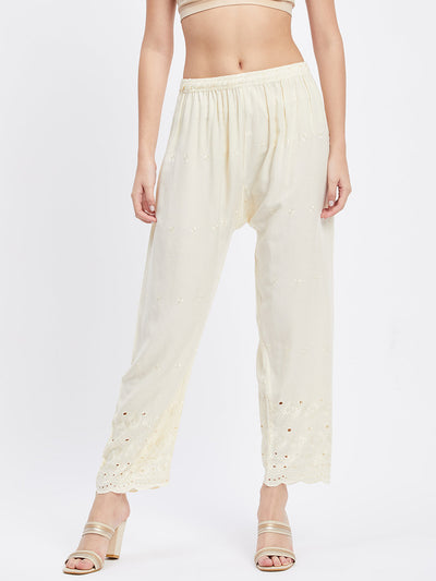 Cream Chikankari solid narrow palazzo with elasticated waistband and drawstring.