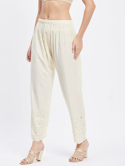 Cream Chikankari solid narrow palazzo with elasticated waistband.