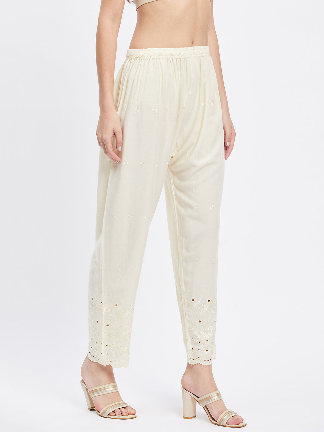 Cream Chikankari solid narrow palazzo with elasticated waistband and drawstring.