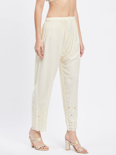 Cream Chikankari solid narrow palazzo with elasticated waistband and drawstring.