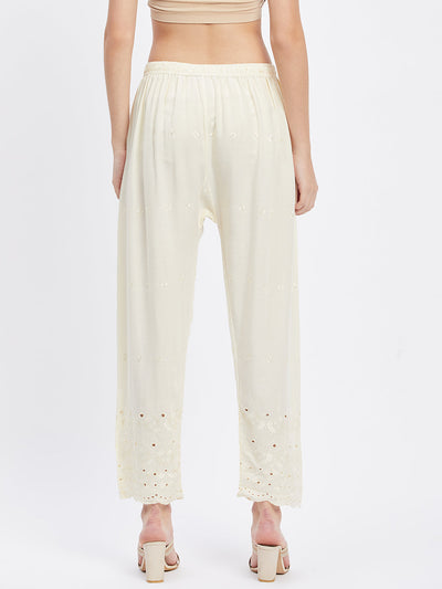 Cream Chikankari solid narrow palazzo with elasticated waistband and drawstring.