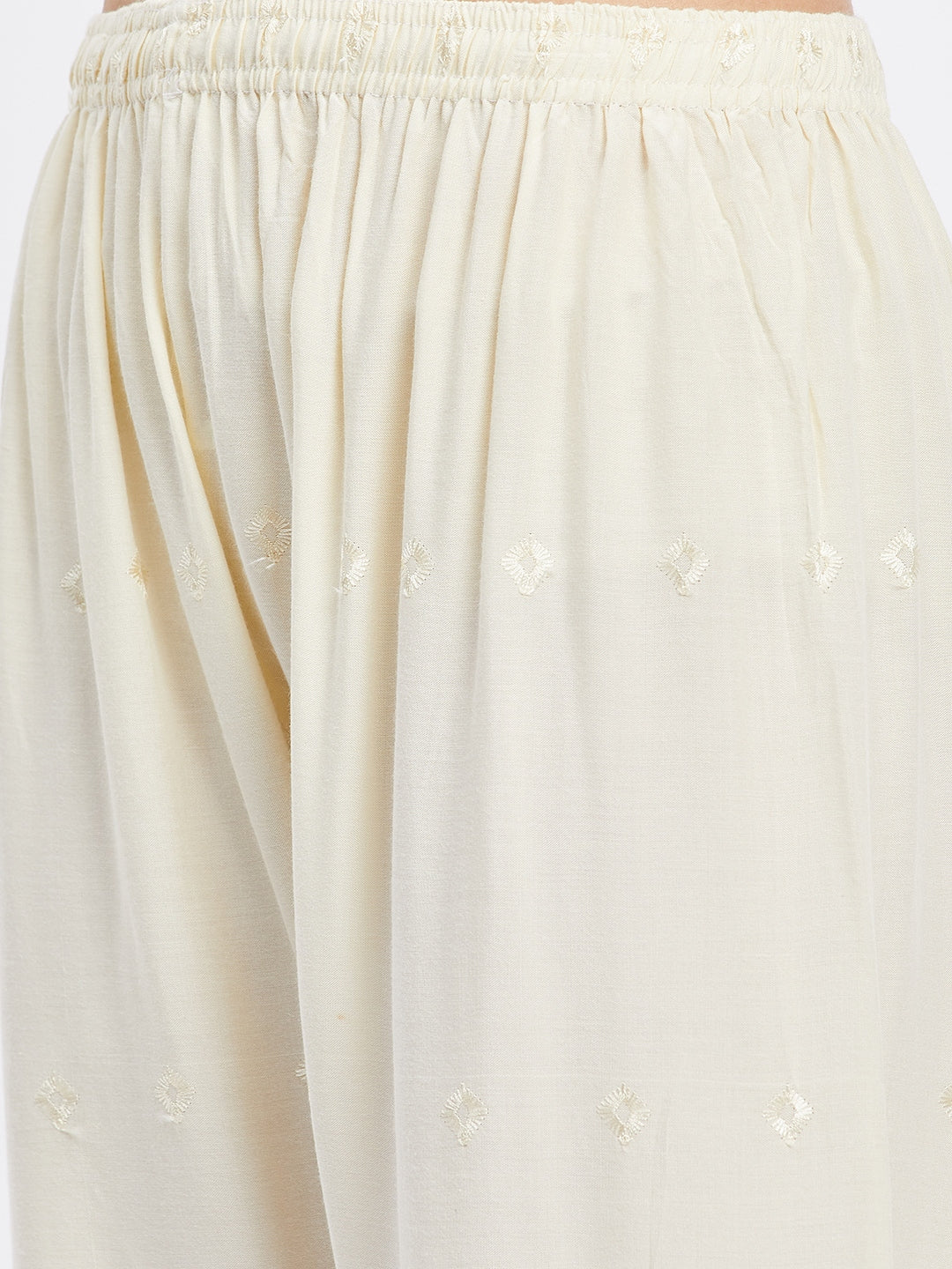 Cream Chikankari solid narrow palazzo with elasticated waistband and drawstring.