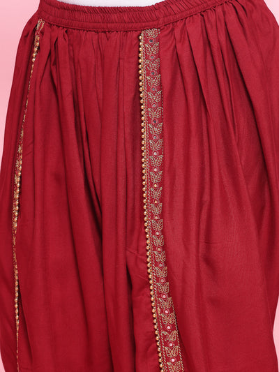 Maroon embroidered rayon dhoti pants with elastic waistband and embellished border.